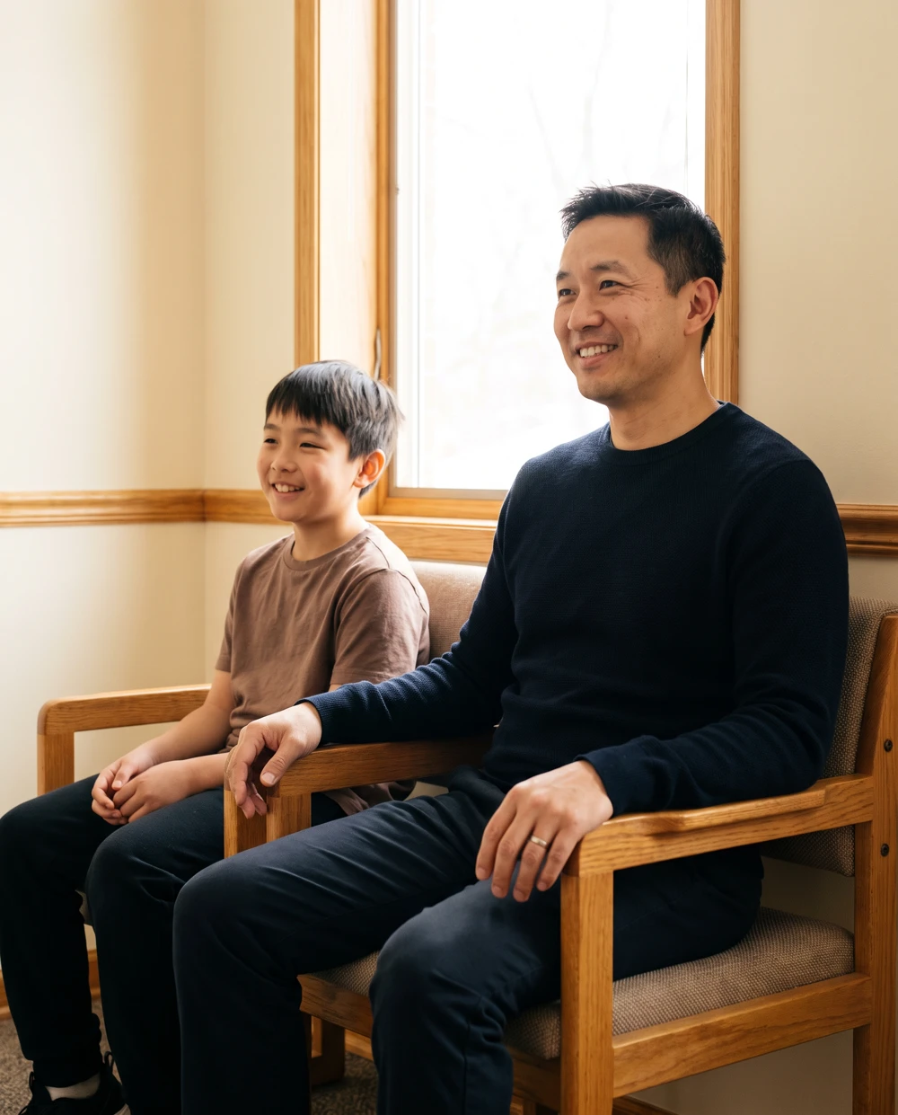Illustrative father and son at a primary care visit